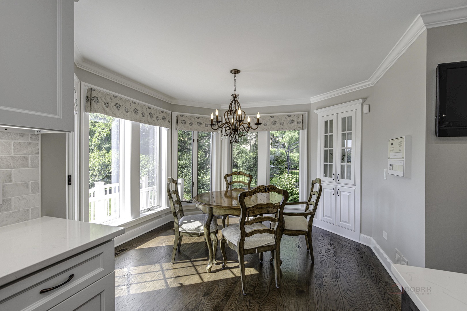 575 West Windsor Road Inverness, IL 60067 - Photo 10 of 54 a view of a dining room with furniture window and wooden floor