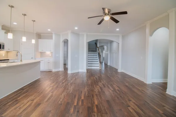 a view of a kitchen and wooden floor