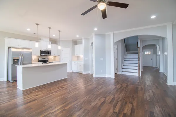 a view of kitchen with cabinets and wooden floor
