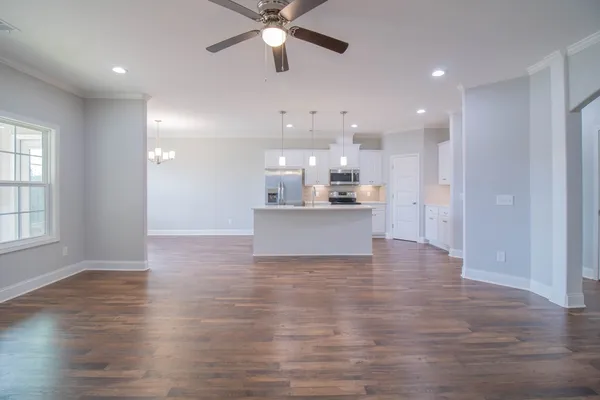 a view of a kitchen with a sink and a window
