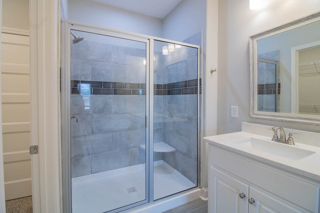 9605 Capot Drive Midland, GA 31820 - Photo 24 of 38 a bathroom with a shower sink and mirror