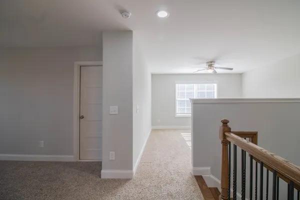 a view of hallway with kitchen and entryway