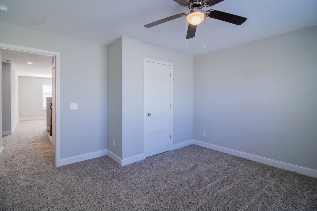 9605 Capot Drive Midland, GA 31820 - Photo 31 of 38 a view of an empty room and chandelier fan