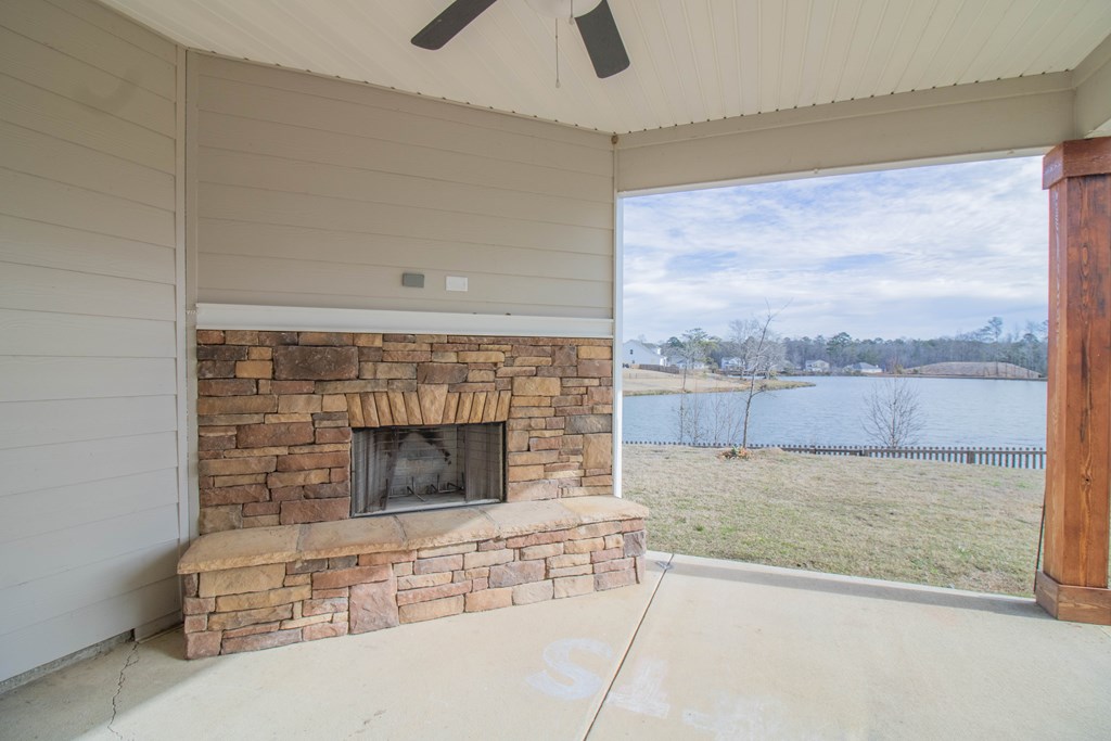 9605 Capot Drive Midland, GA 31820 - Photo 33 of 38 a view of wooden floor and a fireplace in a room