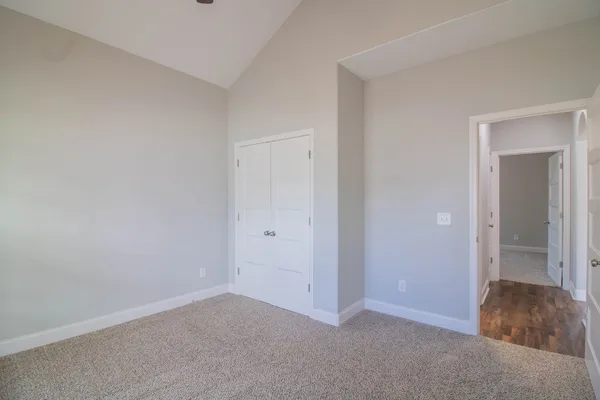 a view of an empty room and closet