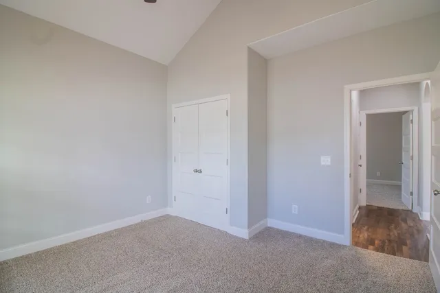 a view of an empty room and closet