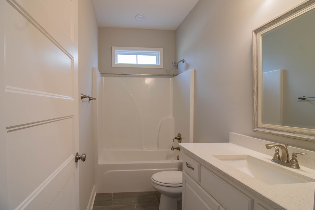 9605 Capot Drive Midland, GA 31820 - Photo 5 of 38 a bathroom with a sink toilet and shower