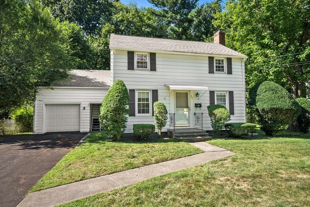 291 Maple Road Longmeadow, MA 01106 - Photo 1 of 26 a front view of a house with a yard