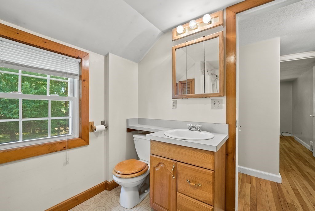 291 Maple Road Longmeadow, MA 01106 - Photo 13 of 26 a bathroom with a granite countertop sink toilet and mirror