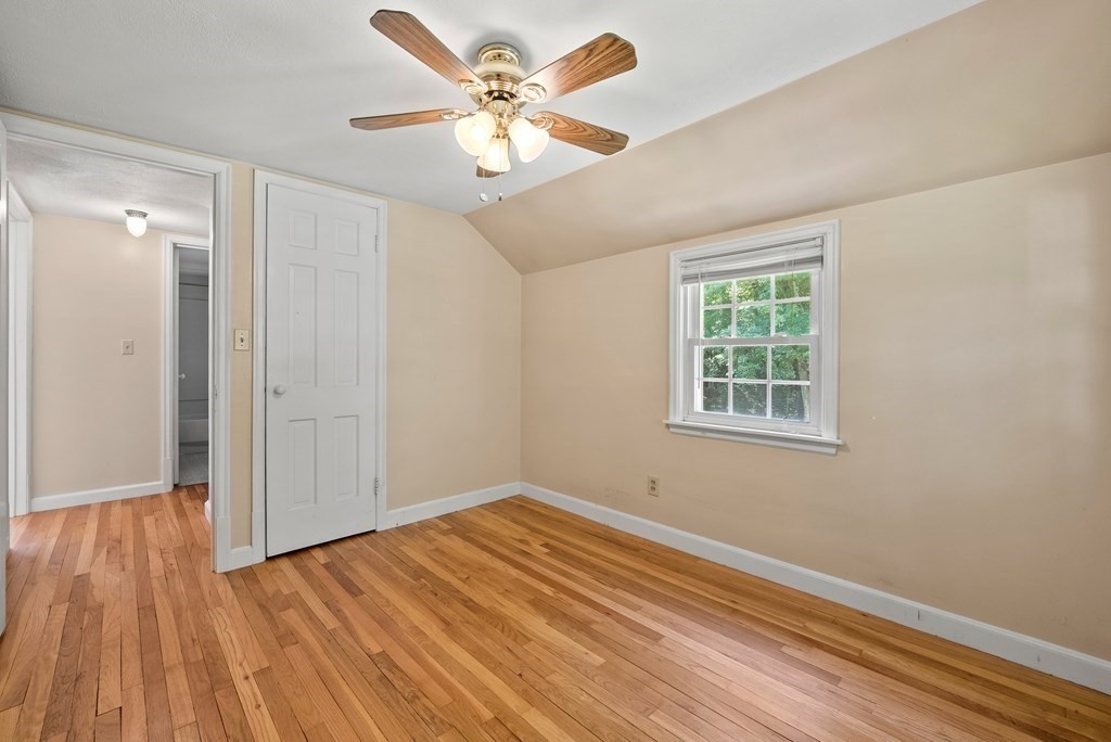 291 Maple Road Longmeadow, MA 01106 - Photo 19 of 26 an empty room with wooden floor and windows