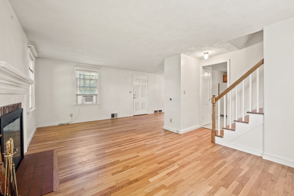 291 Maple Road Longmeadow, MA 01106 - Photo 6 of 26 a view of empty room with wooden floor and fan