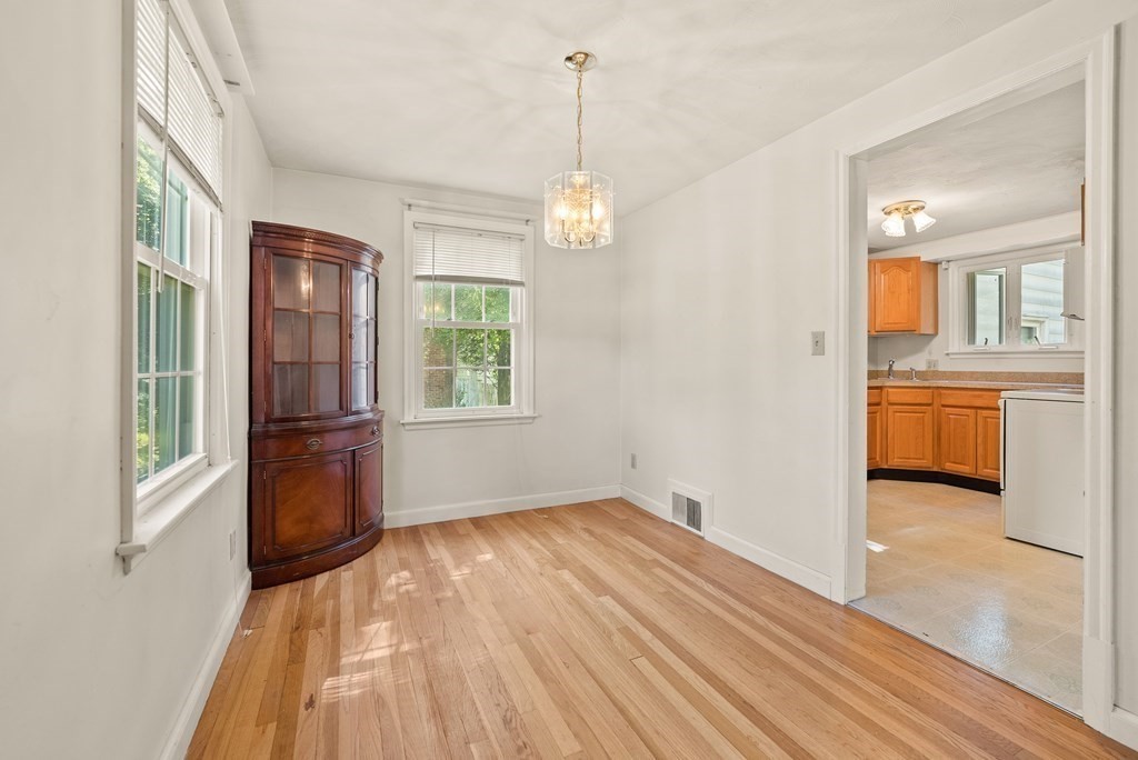 291 Maple Road Longmeadow, MA 01106 - Photo 9 of 26 a view of a room with wooden floor fridge and a window