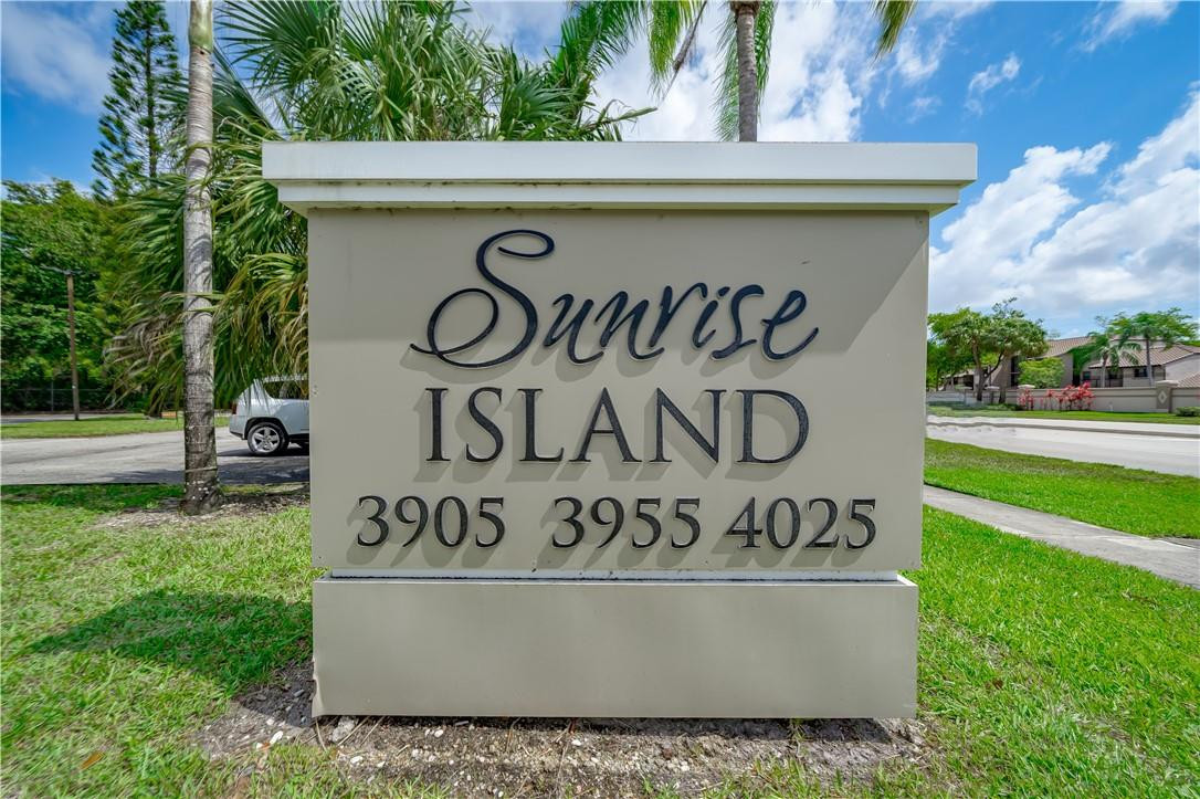 3955 North Nob Hill Road, Unit 408 Sunrise, FL 33351 - Photo 1 of 34 a view of outdoor space with garden and trees