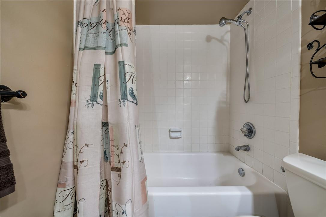 3955 North Nob Hill Road, Unit 408 Sunrise, FL 33351 - Photo 18 of 34 a bathroom with a bathtub a shower and a shower