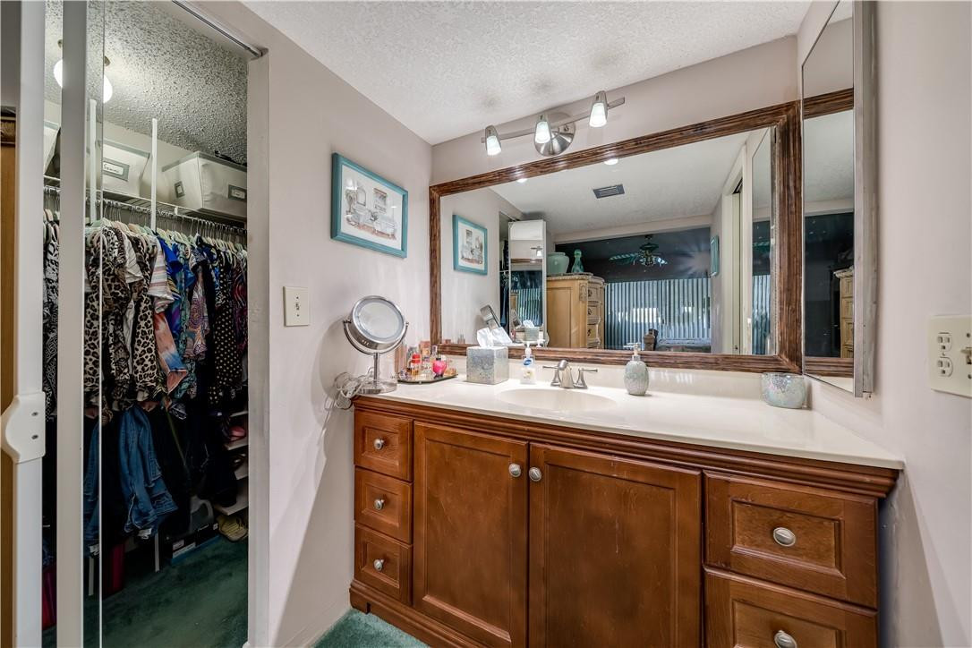 3955 North Nob Hill Road, Unit 408 Sunrise, FL 33351 - Photo 20 of 34 a bathroom with a sink double vanity