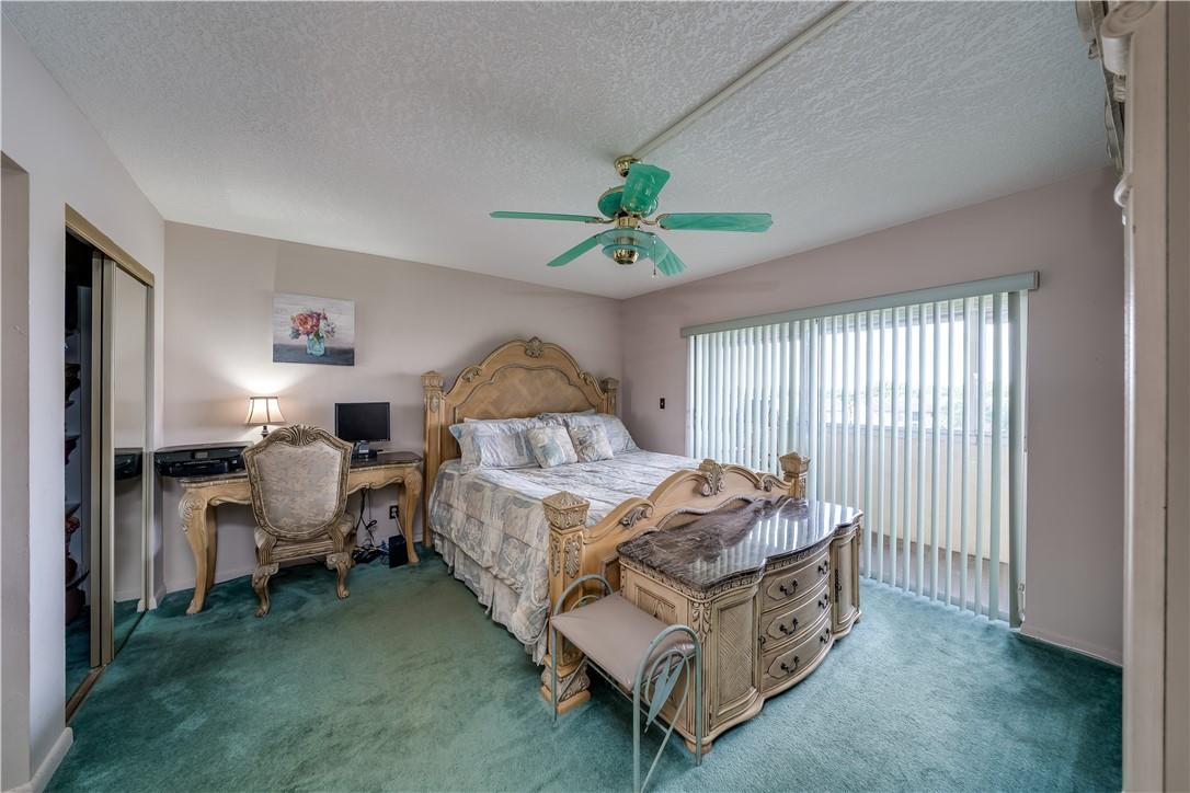 3955 North Nob Hill Road, Unit 408 Sunrise, FL 33351 - Photo 22 of 34 a bed room with a bed and a window