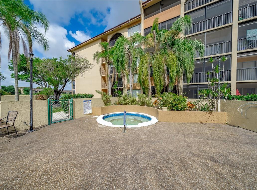 3955 North Nob Hill Road, Unit 408 Sunrise, FL 33351 - Photo 33 of 34 a view of a backyard with a patio