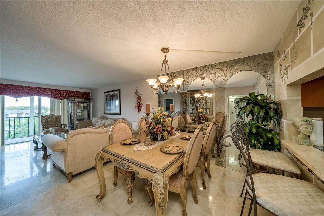 3955 North Nob Hill Road, Unit 408 Sunrise, FL 33351 - Photo 7 of 34 a view of a dining room with furniture window and outside view