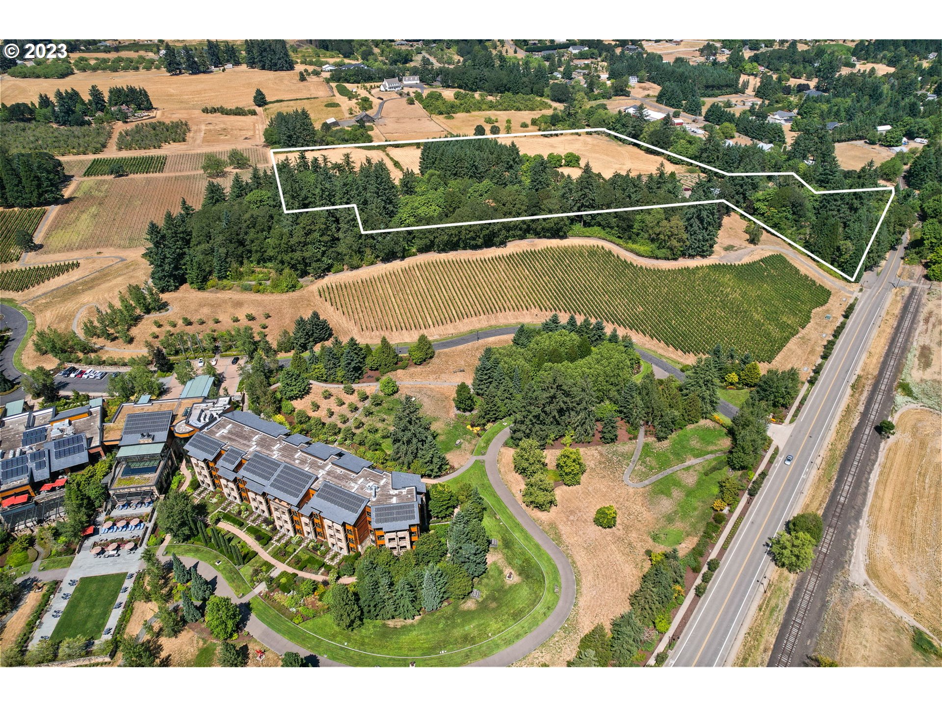 3809 North Springbrook Road Newberg, OR 97132 - Photo 2 of 14 an aerial view of a house with a garden
