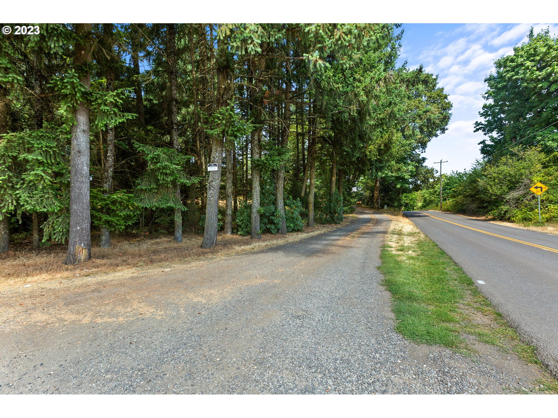 3809 North Springbrook Road Newberg, OR 97132 - Photo 9 of 14 a view of a yard with plants and trees