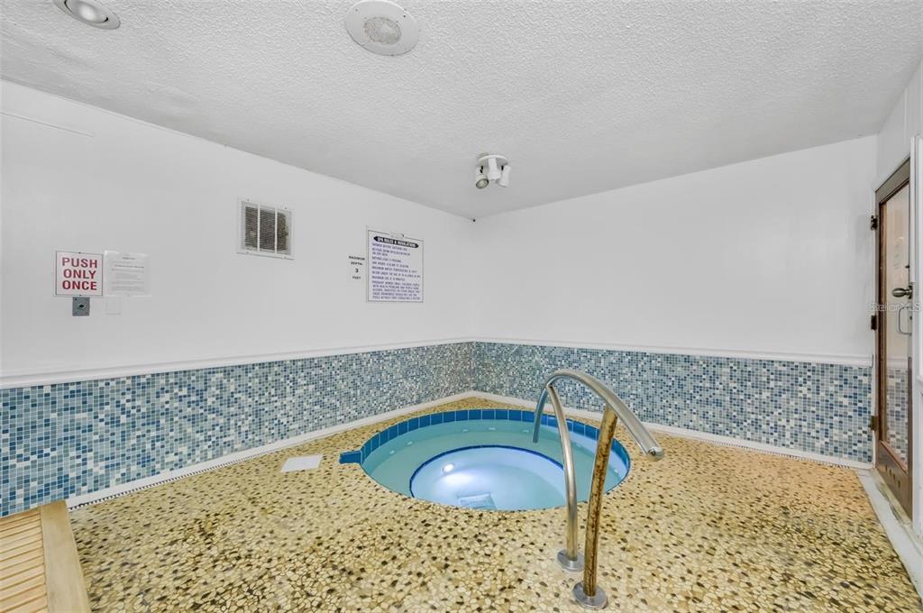 230 Medallion Boulevard, Unit G Madeira Beach, FL 33708 - Photo 34 of 38 a bathroom with a sink and a shower