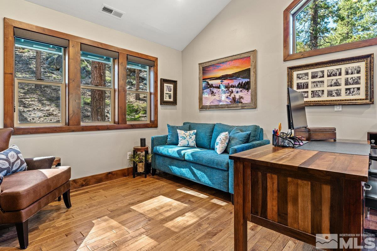 2204 Lands End Road Glenbrook, NV 89413 - Photo 20 of 40 a living room with furniture a window and a flat screen tv