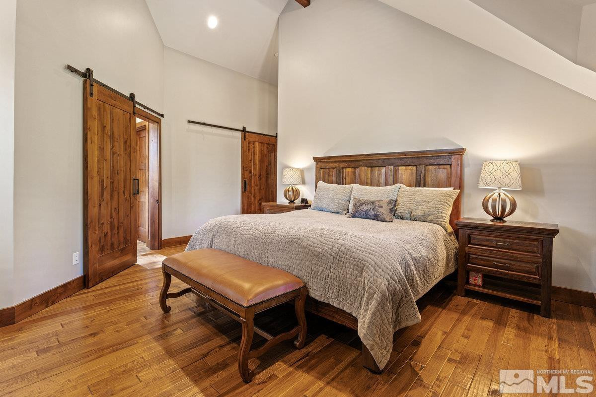 2204 Lands End Road Glenbrook, NV 89413 - Photo 25 of 40 a bed room with a bed and a night stand