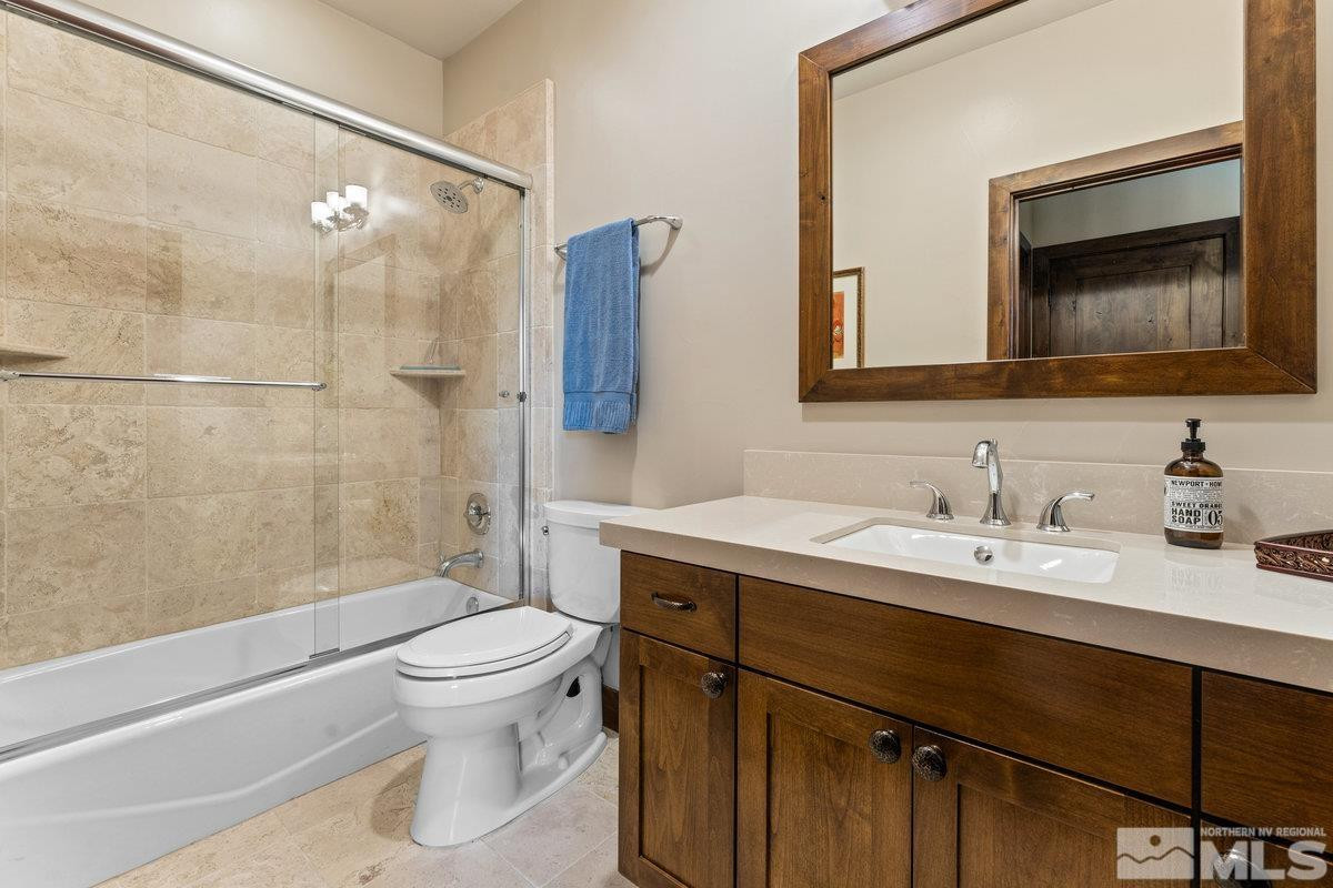 2204 Lands End Road Glenbrook, NV 89413 - Photo 26 of 40 a bathroom with a sink a toilet and shower