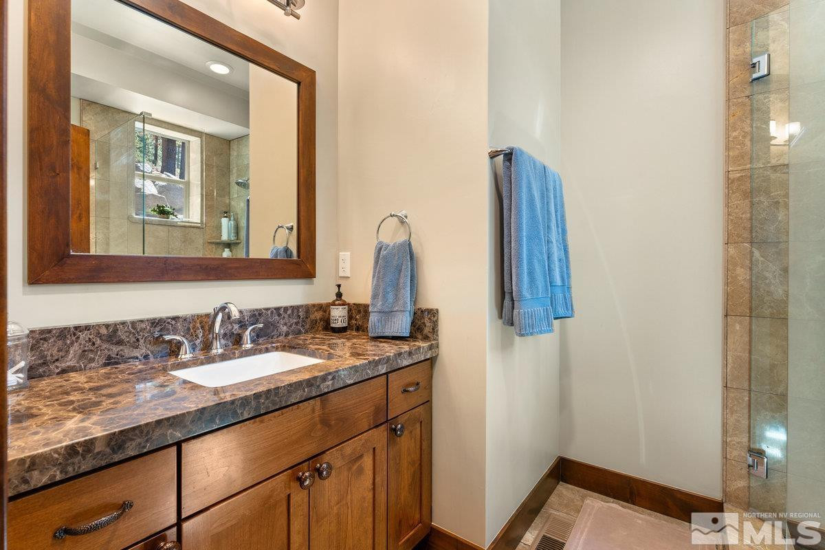 2204 Lands End Road Glenbrook, NV 89413 - Photo 28 of 40 a bathroom with a sink and a mirror