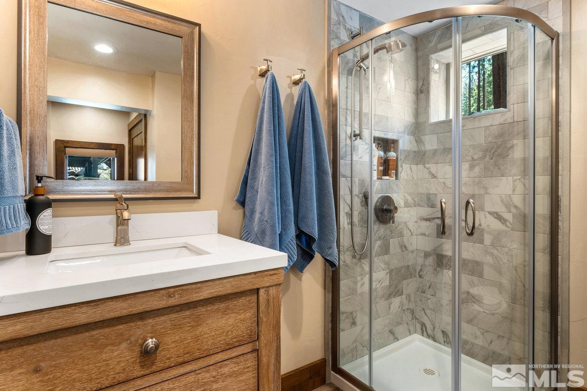 2204 Lands End Road Glenbrook, NV 89413 - Photo 30 of 40 a bathroom with a sink vanity granite and a mirror