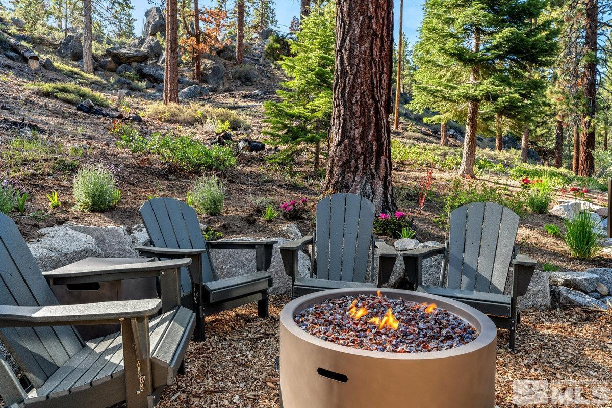 2204 Lands End Road Glenbrook, NV 89413 - Photo 33 of 40 a view of a chairs and table in a backyard