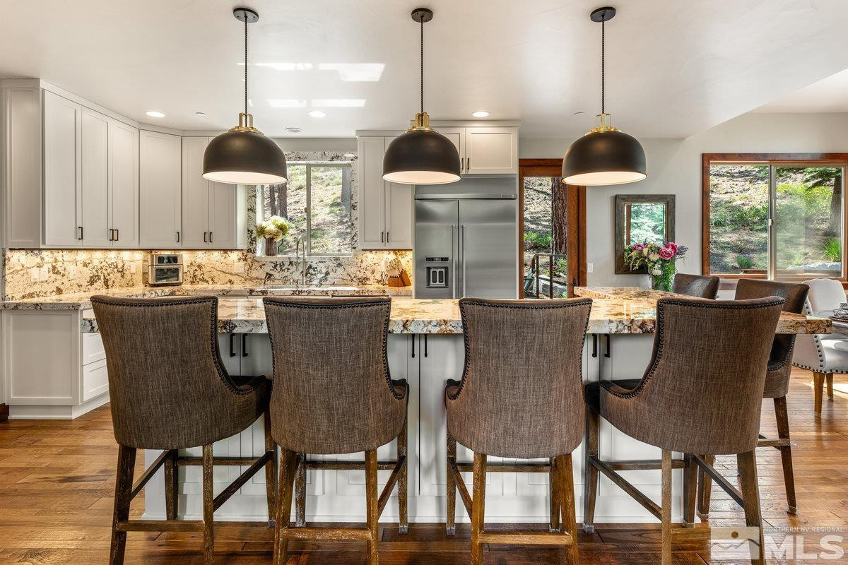 2204 Lands End Road Glenbrook, NV 89413 - Photo 10 of 40 a dining room with furniture window and wooden floor