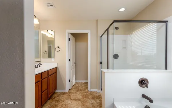 a bathroom with a granite countertop sink mirror and double