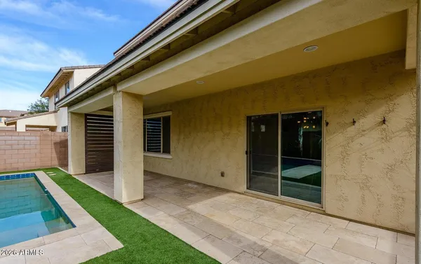 a view of a backyard with palm trees