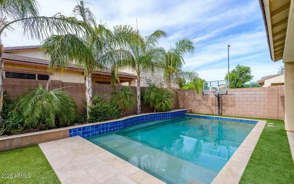 a view of a swimming pool with an outdoor seating