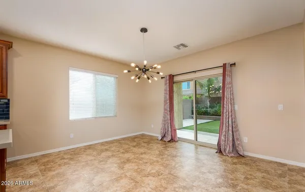 a kitchen with stainless steel appliances granite countertop a refrigerator a sink a stove a microwave and island