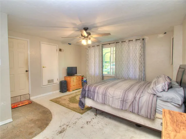 a view of a patio with table and chairs next to a yard