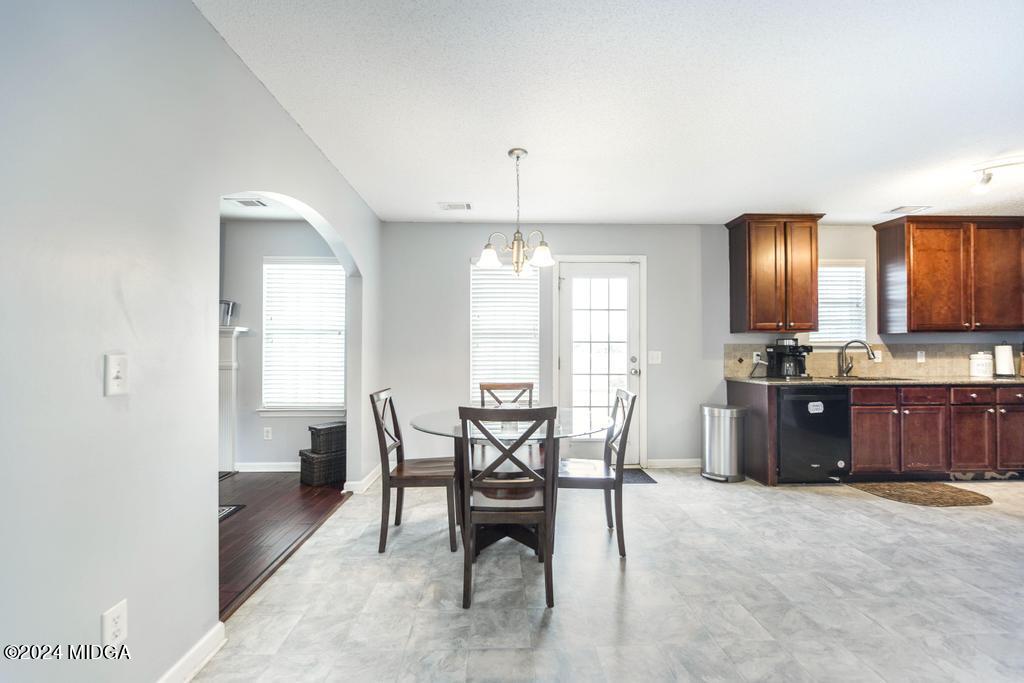 307 Timberwind Drive Byron, GA 31008 - Photo 11 of 27 a view of a dining room with furniture window and outside view