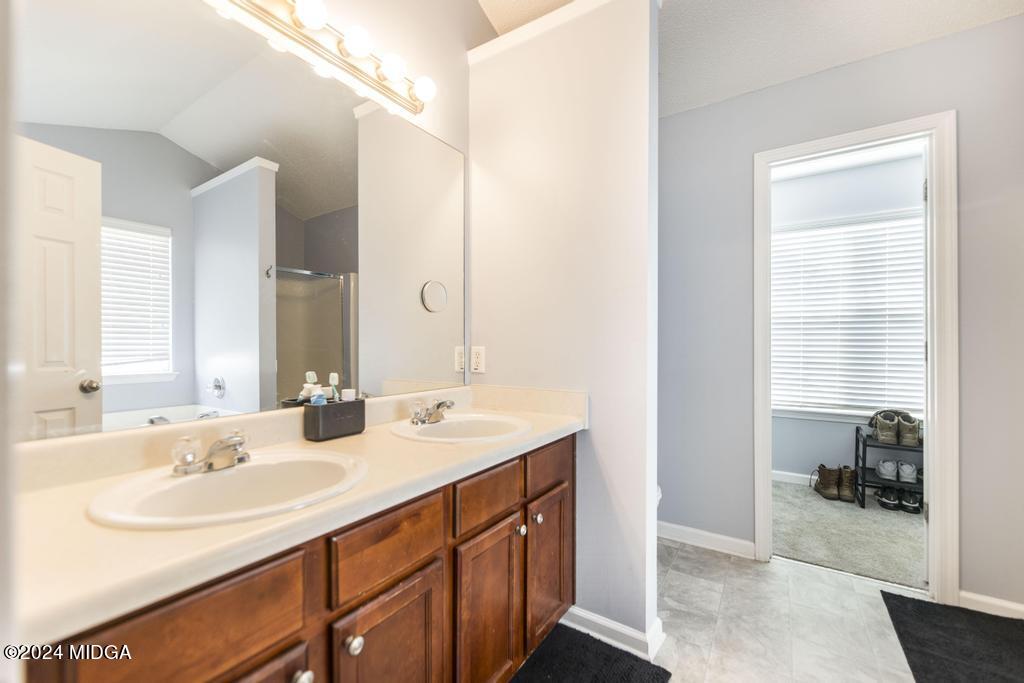 307 Timberwind Drive Byron, GA 31008 - Photo 22 of 27 a bathroom with a sink double vanity and a vanity