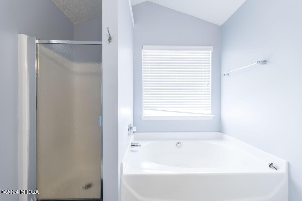 307 Timberwind Drive Byron, GA 31008 - Photo 23 of 27 a bathroom with a bathtub and a shower