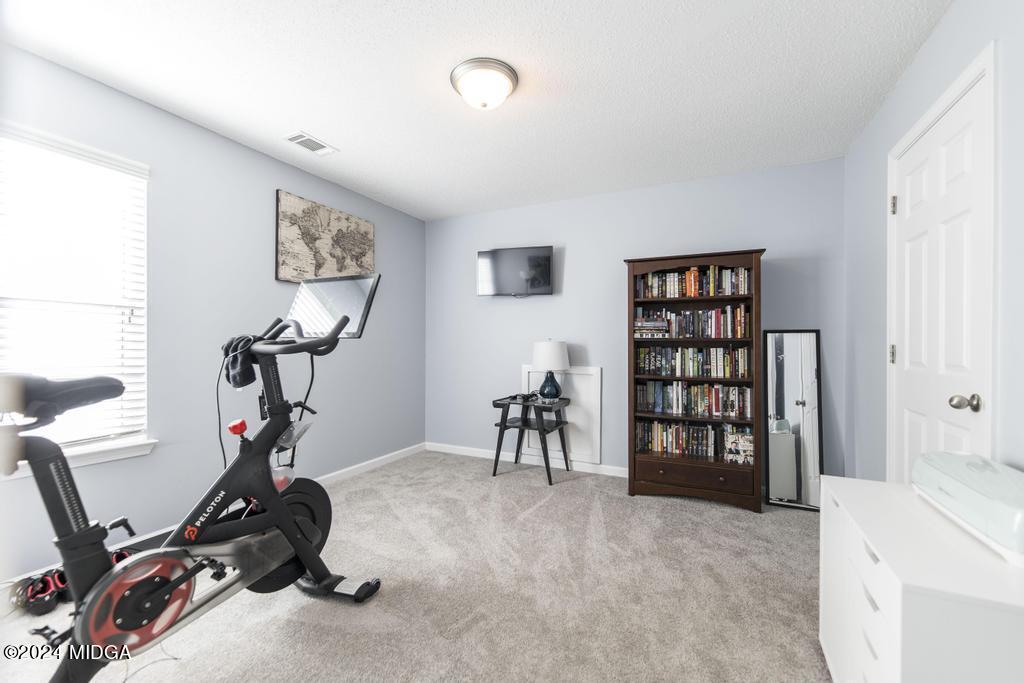 307 Timberwind Drive Byron, GA 31008 - Photo 25 of 27 a view of a room with gym equipment