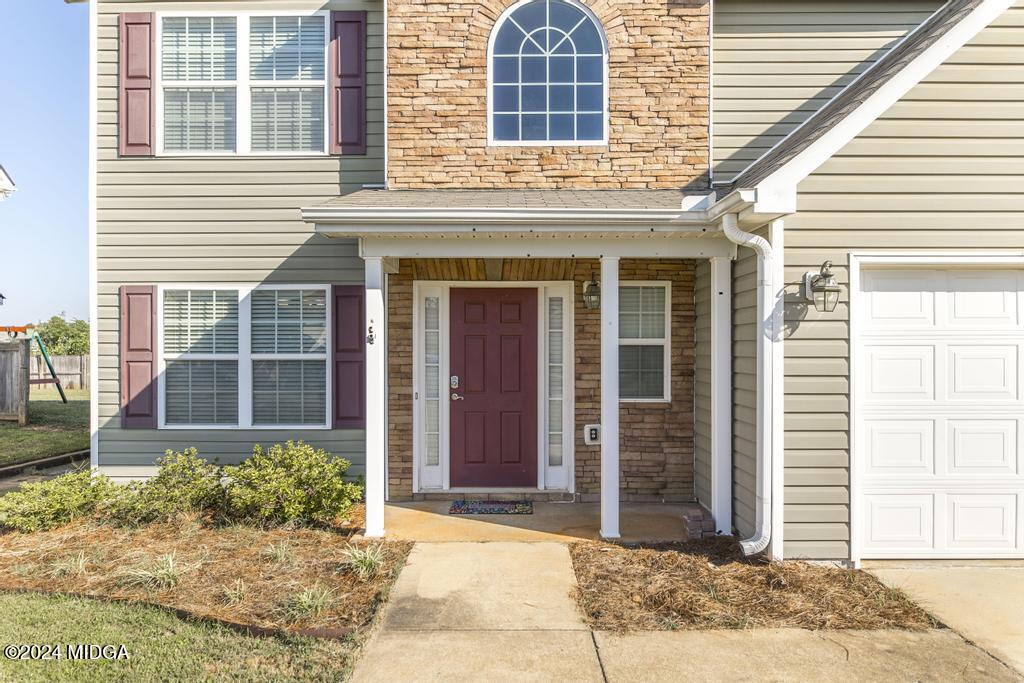 307 Timberwind Drive Byron, GA 31008 - Photo 6 of 27 a front view of a house with a yard
