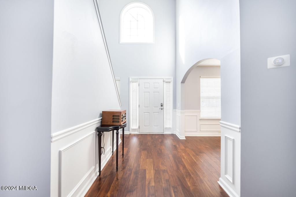 307 Timberwind Drive Byron, GA 31008 - Photo 7 of 27 a view of a room with wooden floor and bench