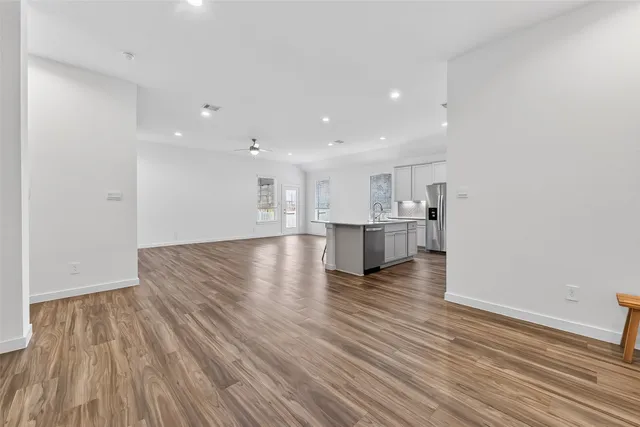 a view of kitchen and kitchen with wooden floor