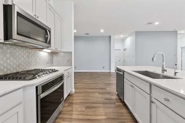 a kitchen with a stove and a microwave