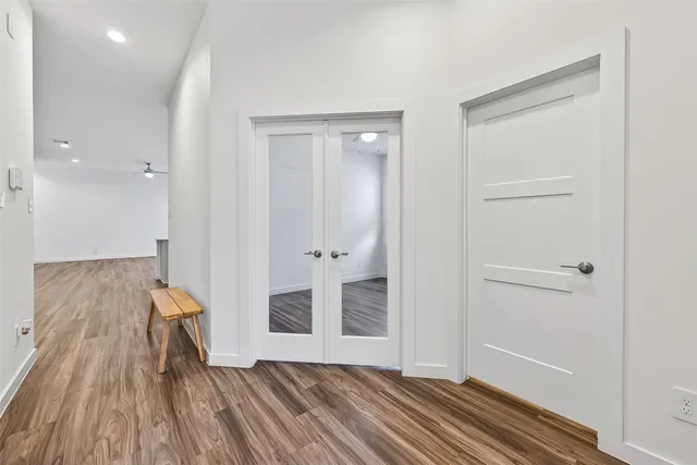 wooden floor with closet in an empty room