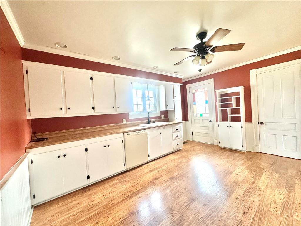 3282 Hann Hill Road Hermitage, PA 16148 - Photo 13 of 41 a large white kitchen with a large window a sink and stainless steel appliances