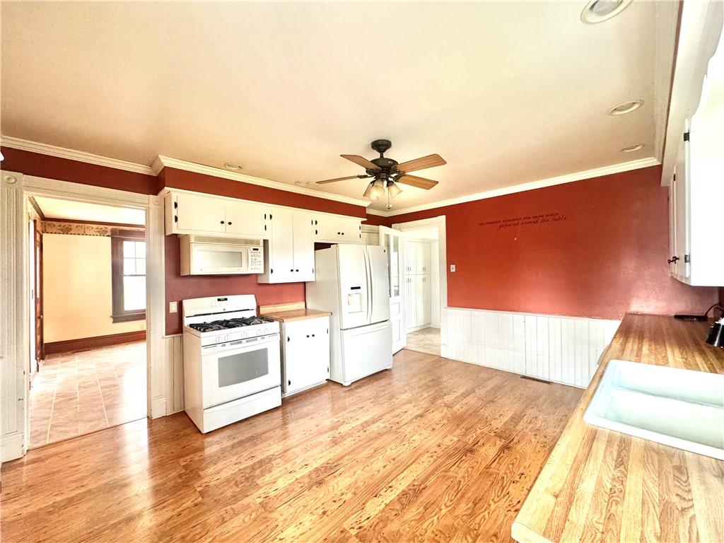 3282 Hann Hill Road Hermitage, PA 16148 - Photo 14 of 41 a view of a kitchen with a sink and a stove top oven