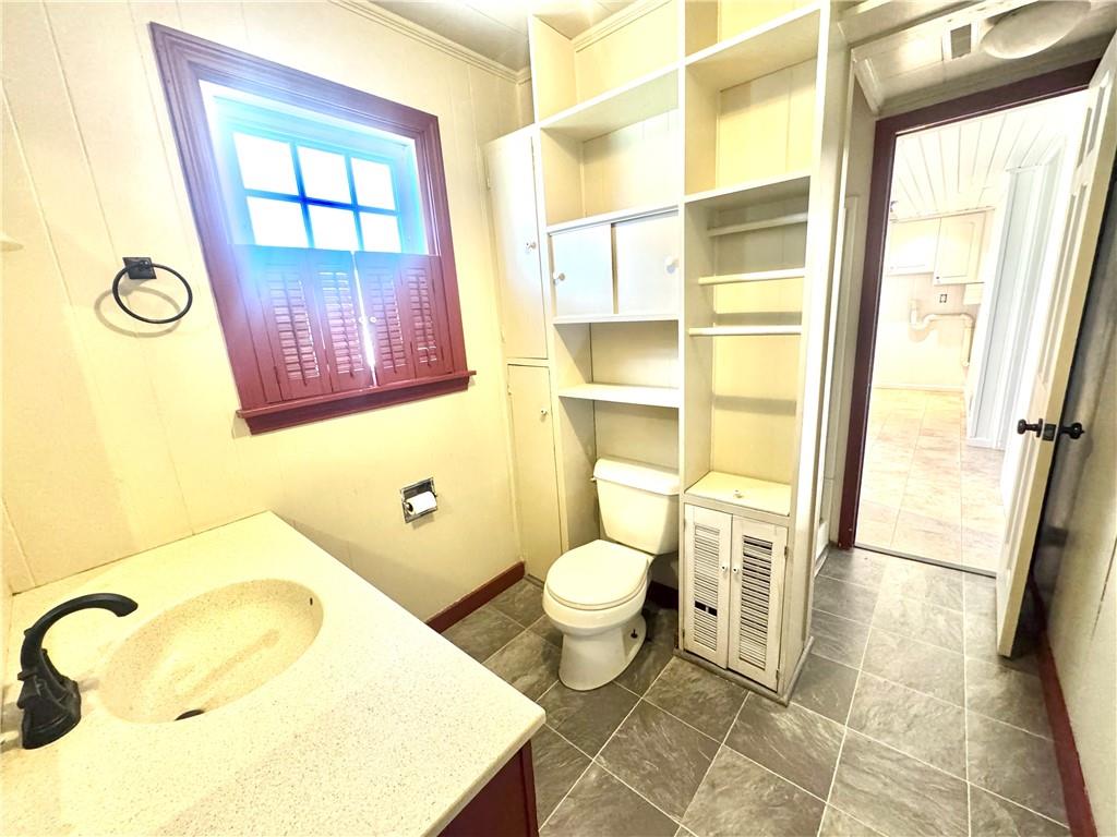 3282 Hann Hill Road Hermitage, PA 16148 - Photo 24 of 41 a bathroom with a granite countertop toilet sink and mirror