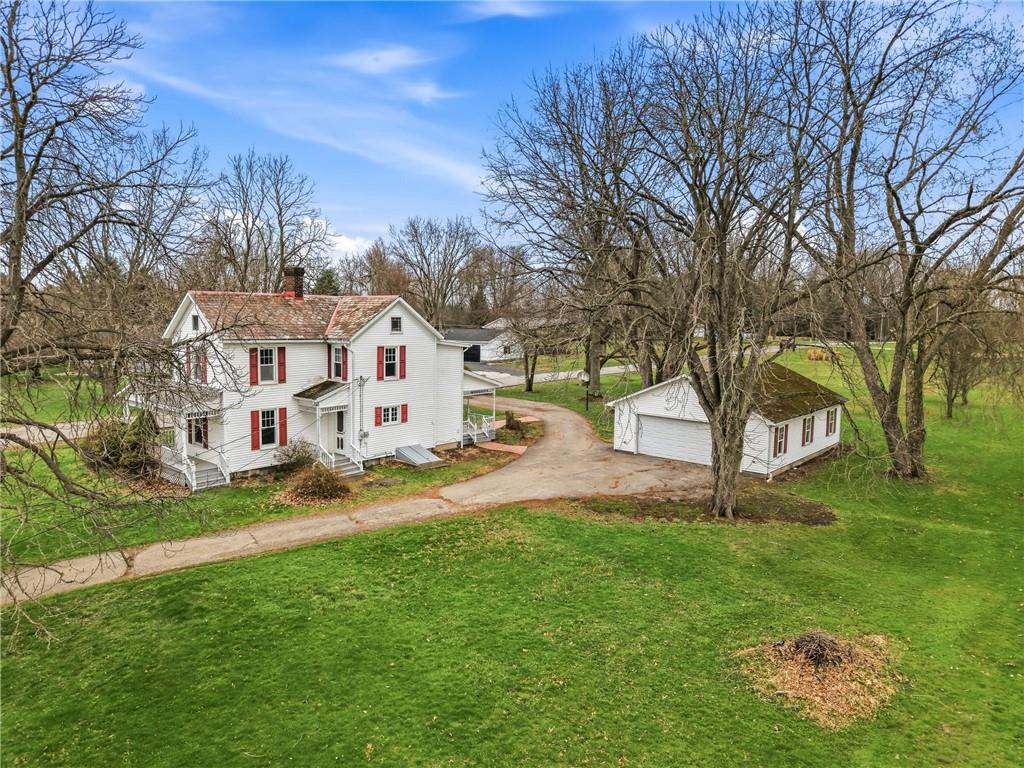 3282 Hann Hill Road Hermitage, PA 16148 - Photo 3 of 41 a view of a white house with a big yard and large trees